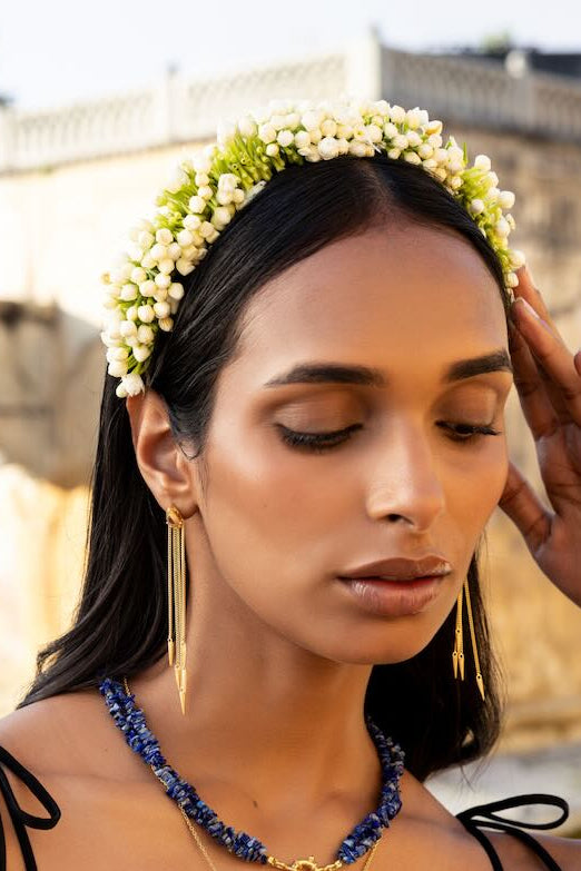 Gold and ruby tassel drop earrings and lapis lazuli twist gem stone necklace.