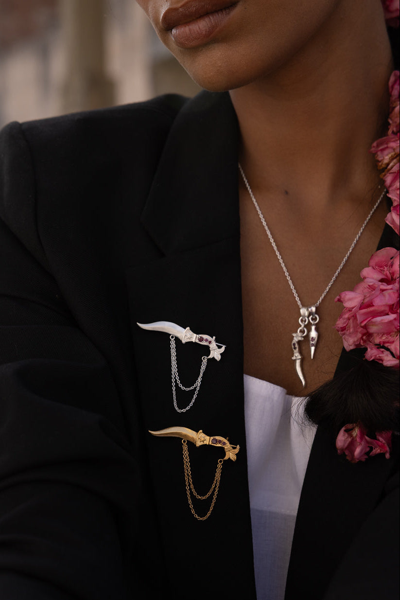 Dagger brooches with rubies.  Dagger & arrow necklace with rubies